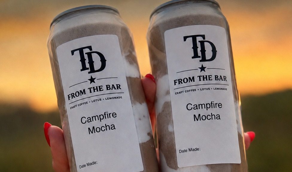 Two Campfire Mocha canned coffees at sunset
