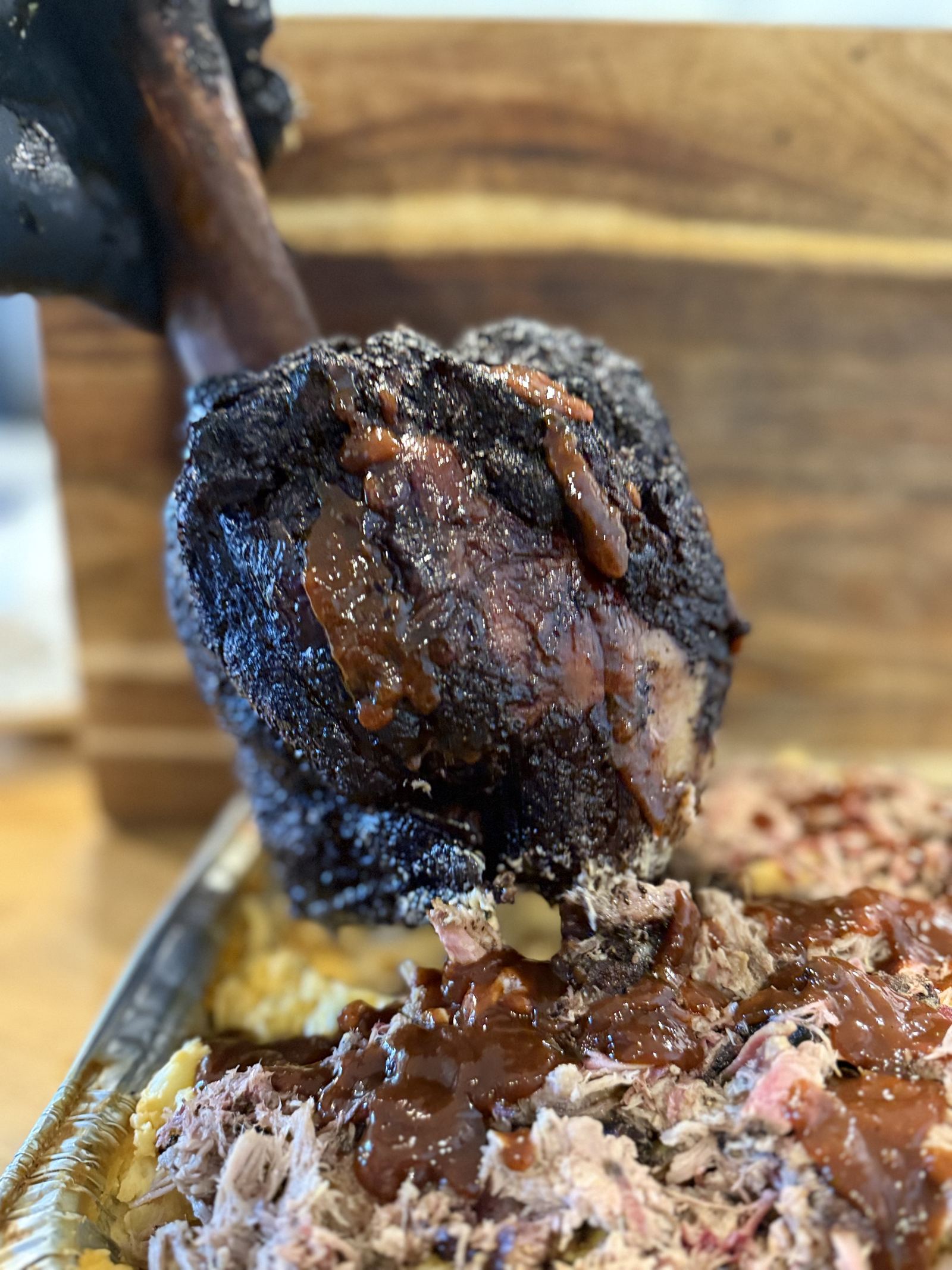 Smoked brisket point with bark and sauce