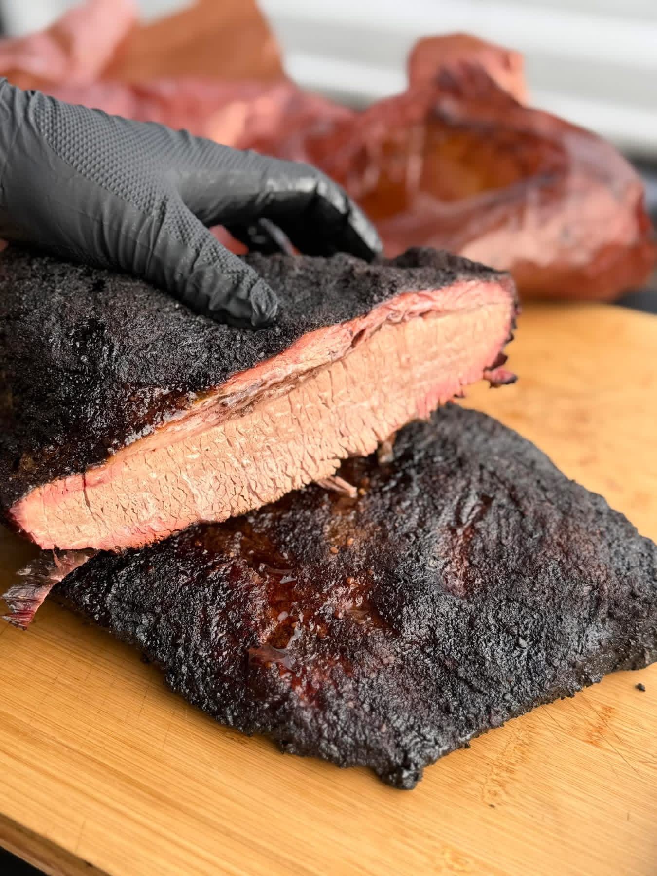 Sliced smoked brisket with a deep smoke ring